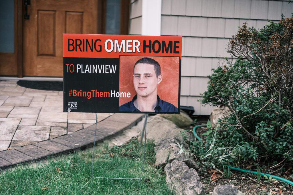 Sign outside the Neutra family home in Plainview, NY, commemorating their son, Omer Neutra, a hostage held by Hamas