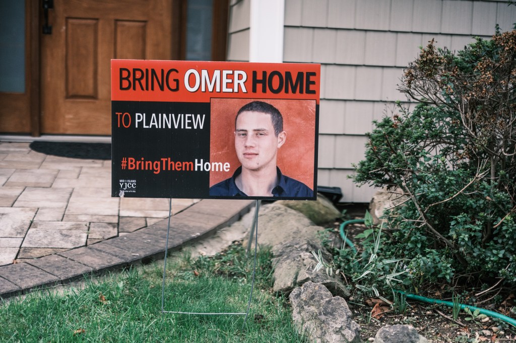 Sign outside the Neutra family home in Plainview, NY, commemorating their son, Omer Neutra, a hostage held by Hamas
