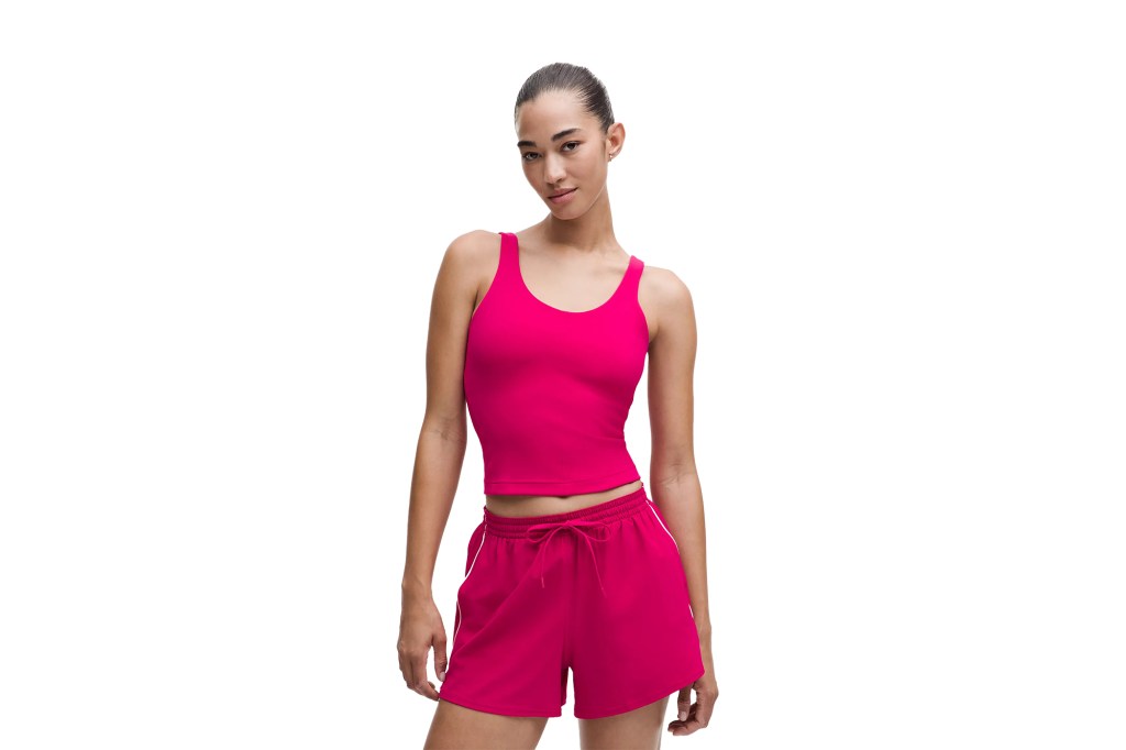 woman wearing a pink tank top and shorts