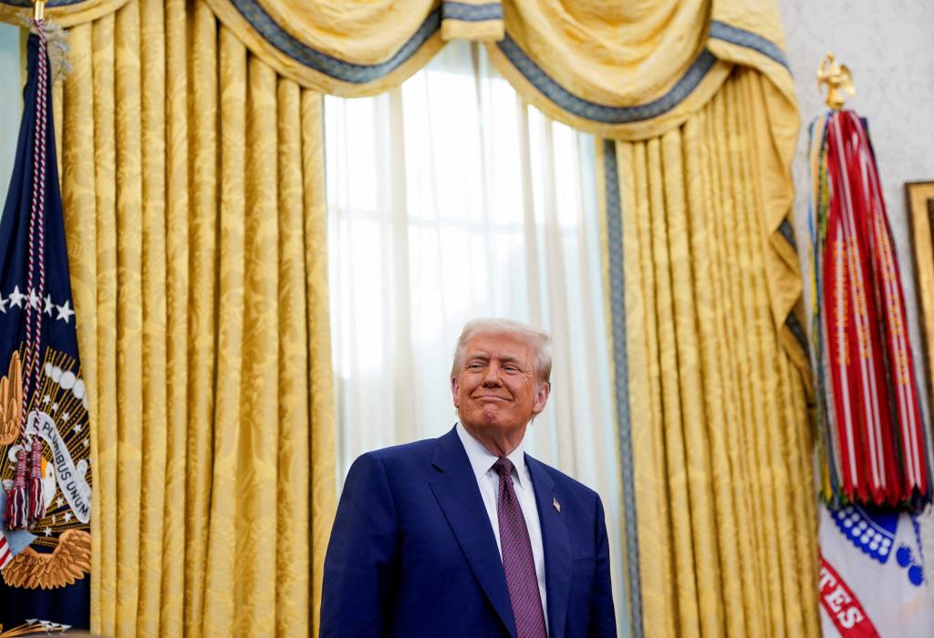 U.S. President Donald Trump looks on as he stands in the Oval Office of the White House.