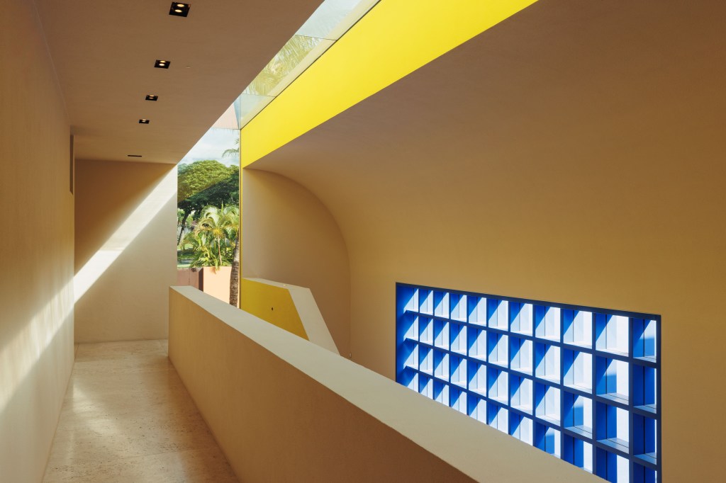 The property, designed by architect Ricardo Legorreta, features vibrant geometric designs, a lap pool, a wine room, and arcade games. 
