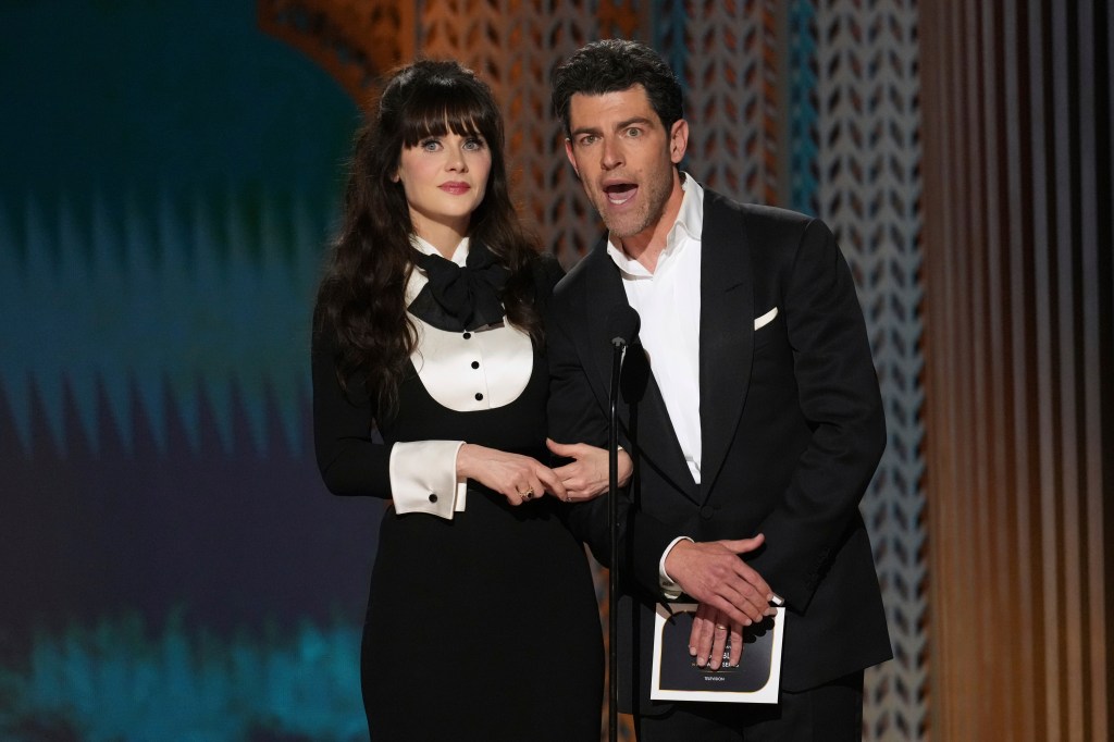 
Zoey Deschanel, left, and Max Greenfield presents the award for outstanding performance by an ensemble in a comedy series during the 31st annual Screen Actors Guild Awards on Sunday, Feb. 23, 2025,