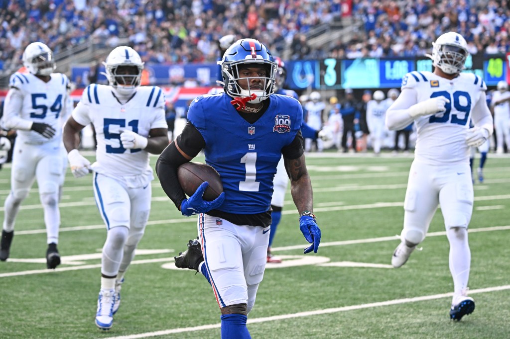 Giants wide receiver Malik Nabers (1) runs the ball for a touchdown during the first quarter of the Giants and Indianapolis Colts game in East Rutherford, N.J. 