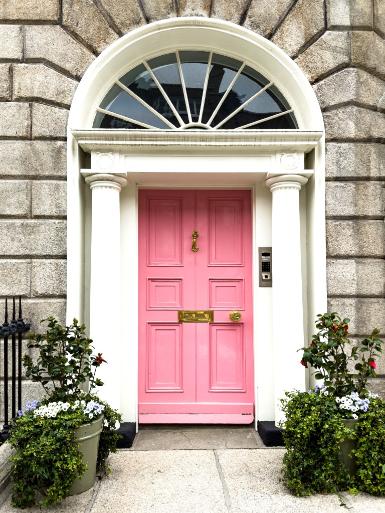 A pink door on a house