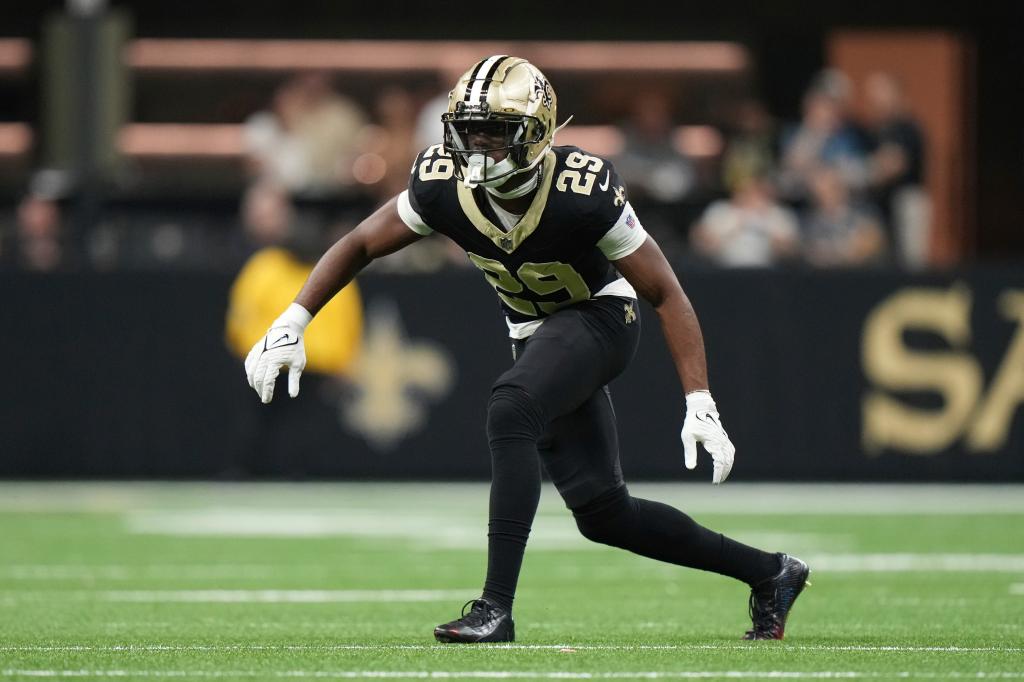 New Orleans Saints cornerback Paulson Adebo (29) watches the passer as he defends during an NFL football game against the Tampa Bay Buccaneers, October 13, 2024, in New Orleans. 