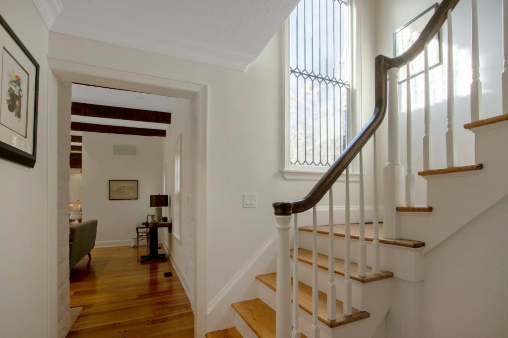 Renovated mid-century Mountain View Farmhouse with original details, featuring a staircase, located on South Mountain Road, New City, New York, with historical ties to film industry celebrities.