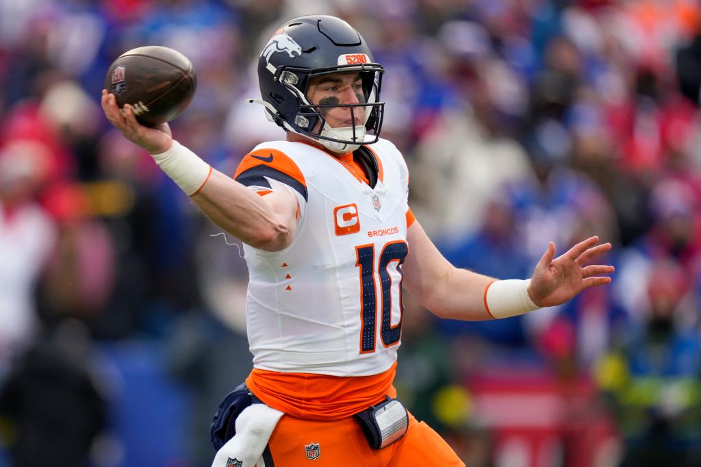 Denver Broncos quarterback Bo Nix (10) passes against the Buffalo Bills during the second quarter of an NFL wild card playoff football game, Sunday, Jan. 12, 2025, in Orchard Park, N.Y.