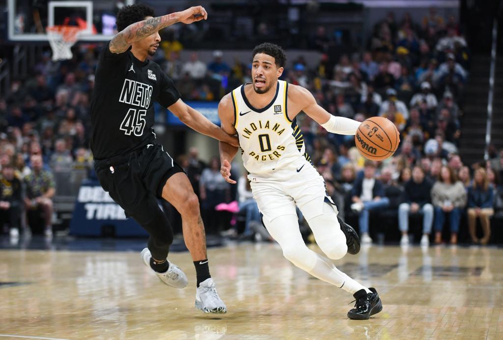 Tyrese Haliburton, who nearly recorded a triple double, drives on Keon Johnson during the Nets' 108-103 loss to the Pacers on March 22, 2025.