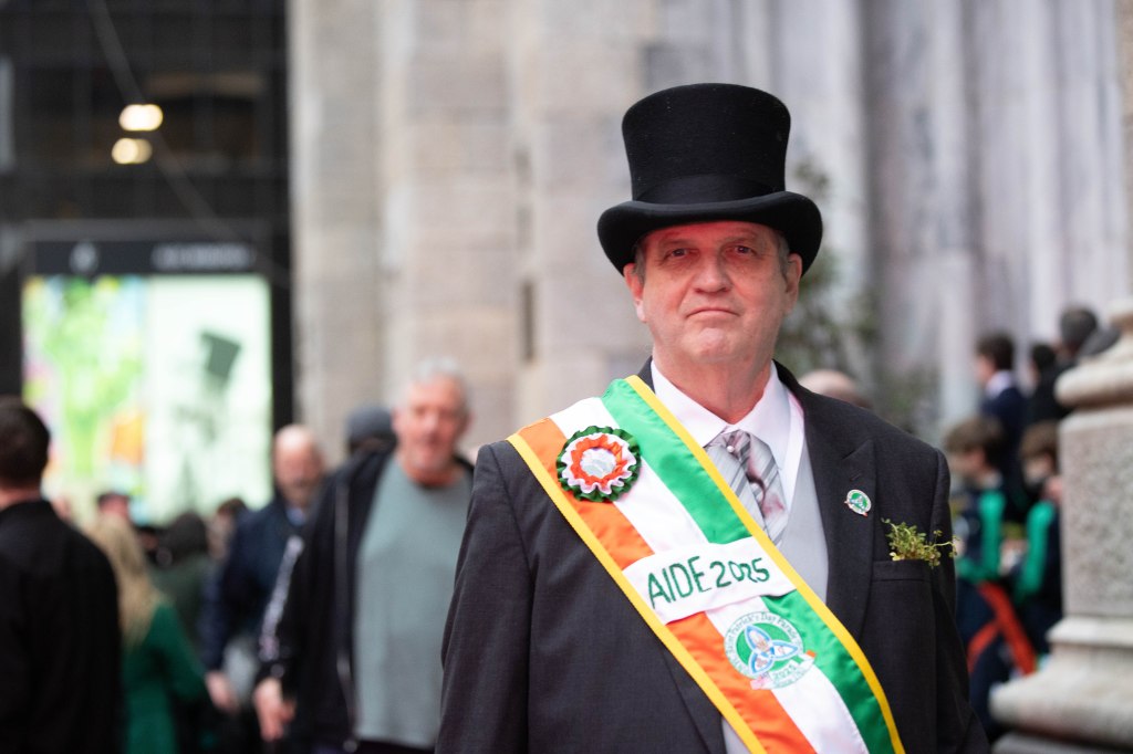 Aide to the Marshall Bill Corrighan of the Queens County Ancient Order of Hibernians is seen preparing for St. Patrick's Day on the steps of St. Patrick's Cathedral.