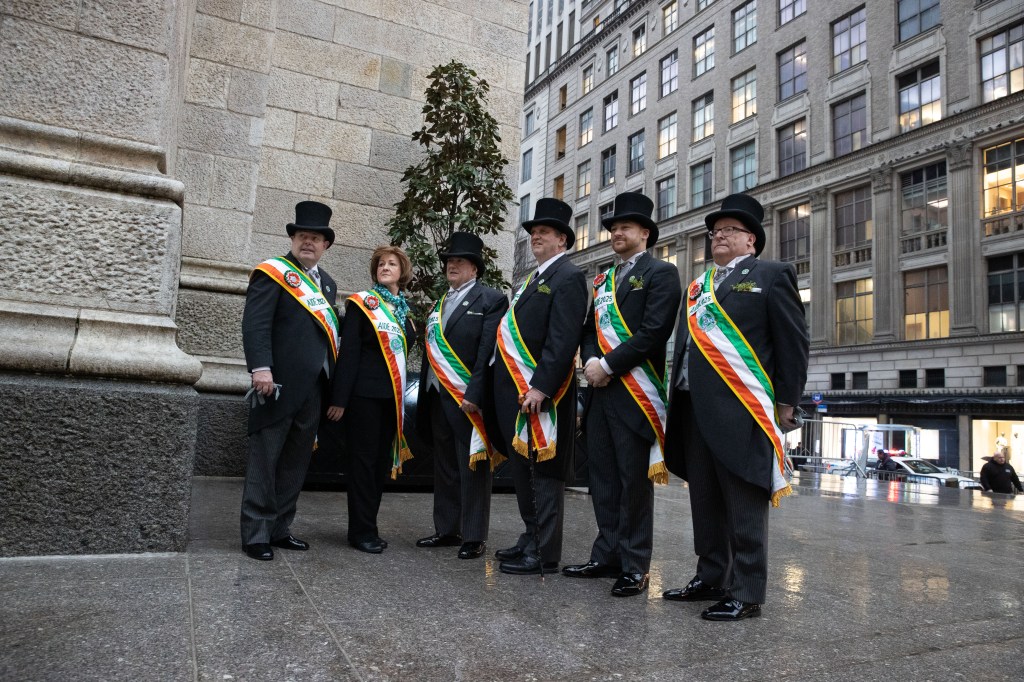 Aides to the Marshall, members of the Ancient Order of Hibernians representing various New York counties are seen posing for a photo for St. Patricks Day on the steps of St. Patricks Cathedral