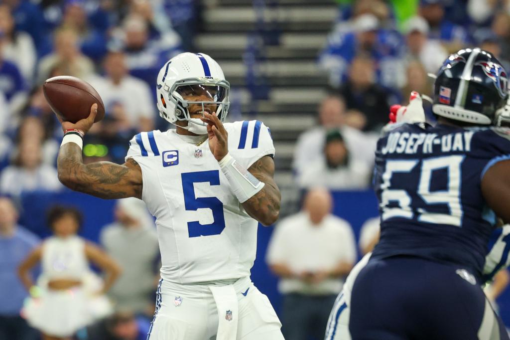 Anthony Richardson #5 of the Indianapolis Colts looks to pass against Sebastian Joseph-Day #69 of the Tennessee Titans during the first quarter at Lucas Oil Stadium on December 22, 2024 in Indianapolis, Indiana. 