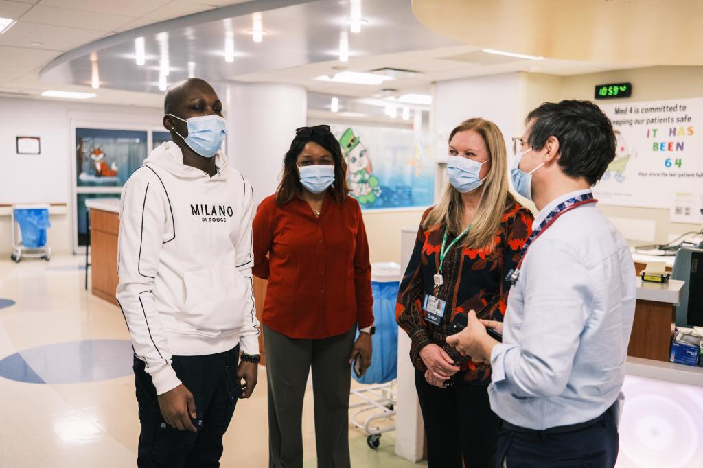 Sebastien Beauzile, his mother Magda Lamour, Dr. Banu Aygun and Dr. Yonatan Diamond at Cohen Children's Medical Center in New Hyde Park, NY, discussing Sebastien’s sickle cell anemia treatment.