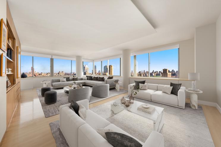 Large, spacious living room in a 4,524-square-foot, five-bedroom apartment on the 28th floor of the Park Millennium, featuring white couches and a large window overlooking the Upper West Side.