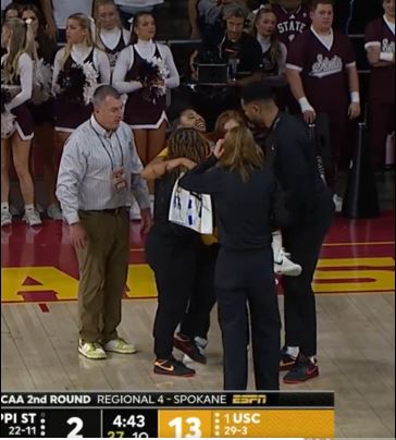 JuJu Watkins is carried off the court after sustaining a leg injury on Monday night during USC's game.