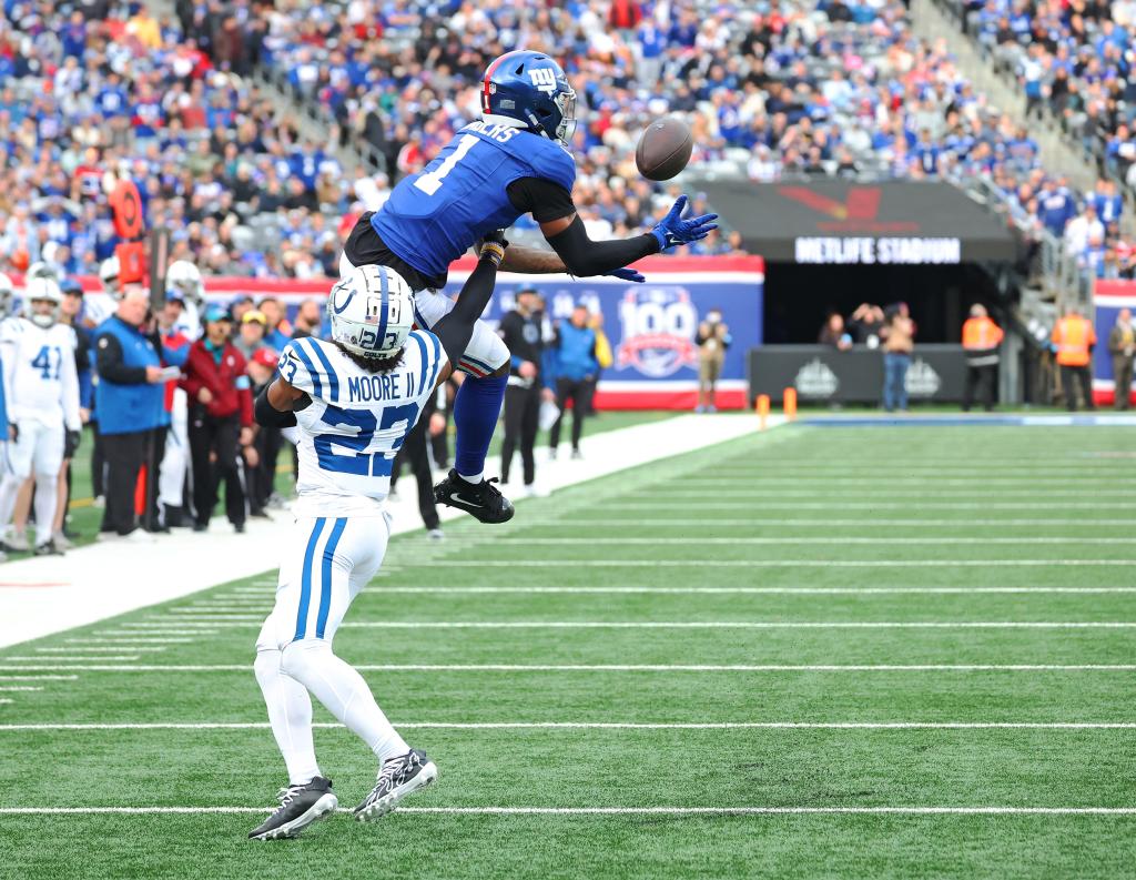  Giants wide receiver Malik Nabers (1) jumps to make a reception as Indianapolis Colts cornerback Kenny Moore II (23) defends during the first half when the New York Giants played the Indianapolis Colts 