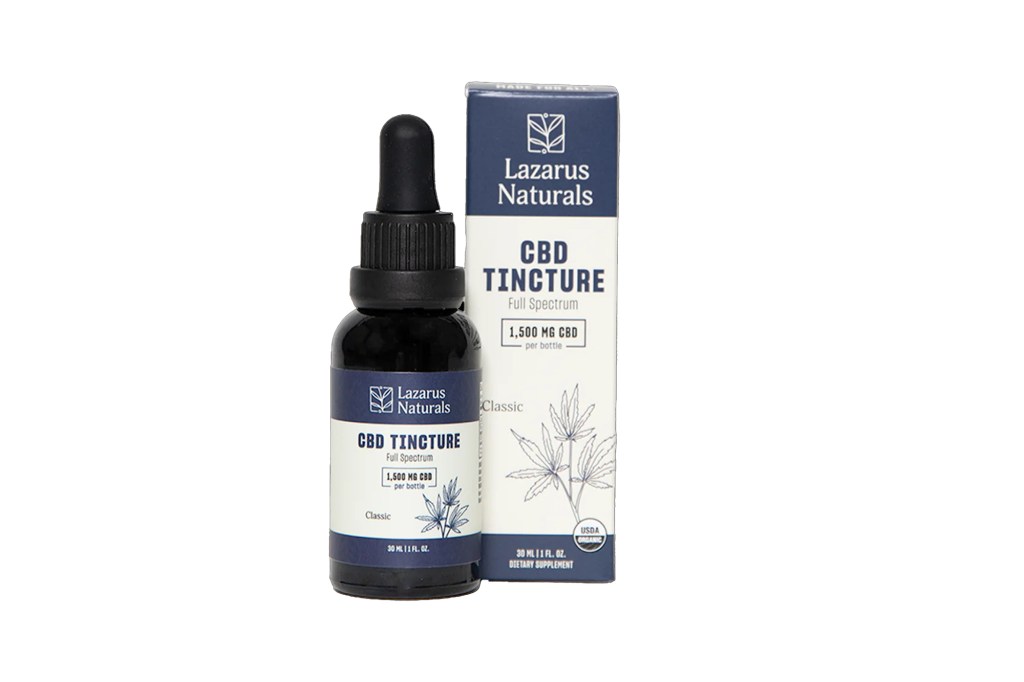 A bottle of CBD tincture next to a box