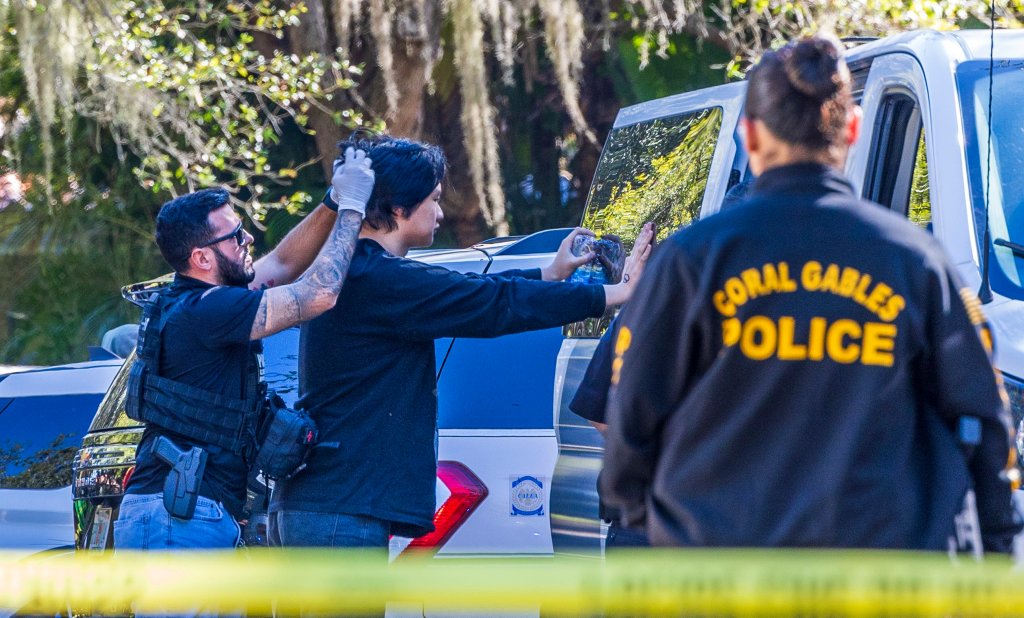Law enforcement officers processing migrants in Coral Gables, Florida on January 28, 2025.