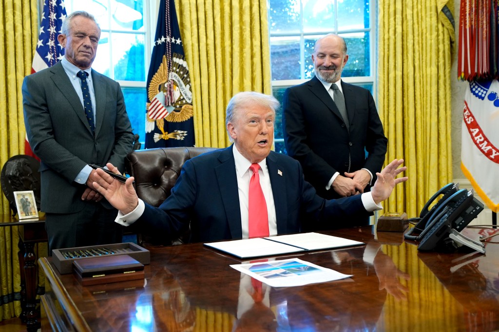 Health and Human Services Secretary Robert F. Kennedy Jr., President Donald Trump and Commerce Secretary Howard Lutnick in the Oval Office.
