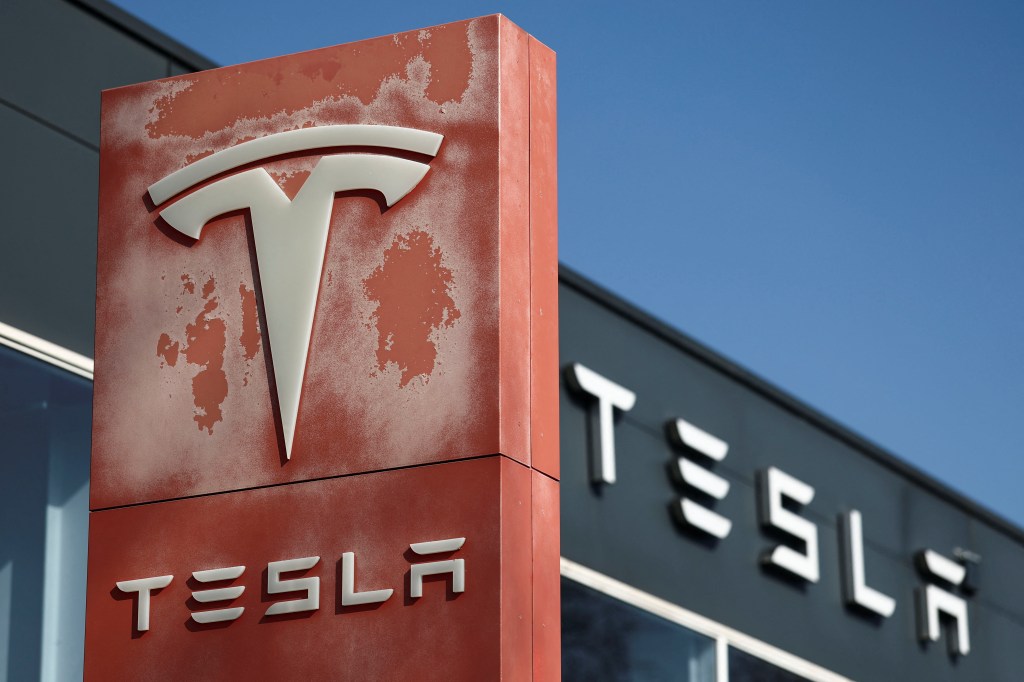 The logo of Tesla is pictured at a dealership in Saint-Herblain near Nantes, France, March 27, 2025. 
