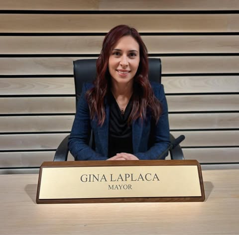 GIna LaPlaca with a name tag in front of her