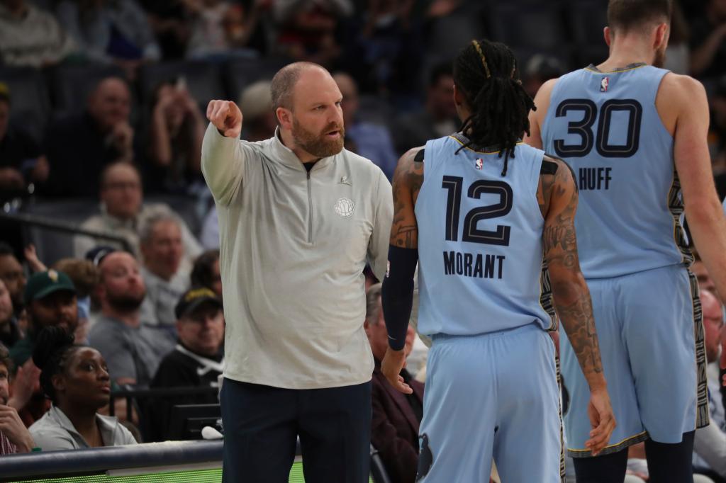 Grizzlies head coach Taylor Jenkins, left, instructs guard Ja Morant (12) during a game against the Phoenix Suns.