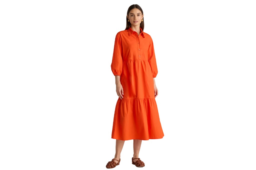 A woman wearing an orange dress
