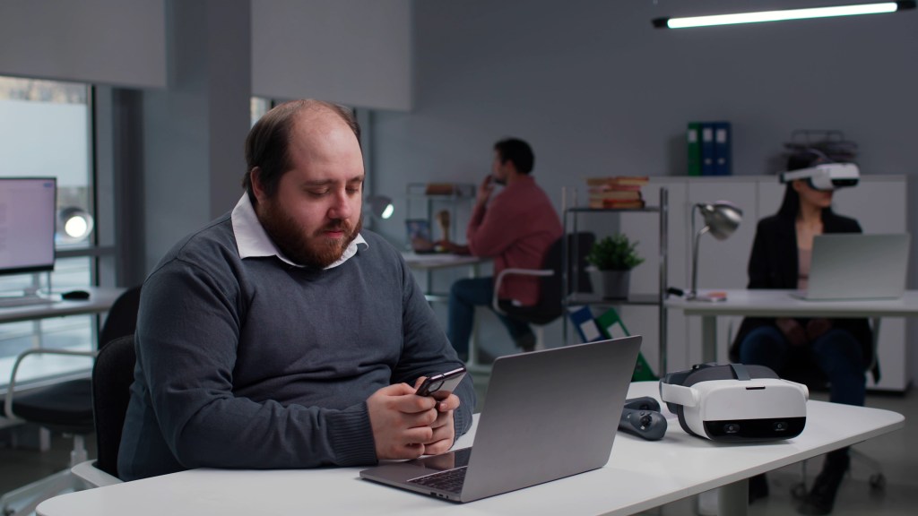 man sitting at desk