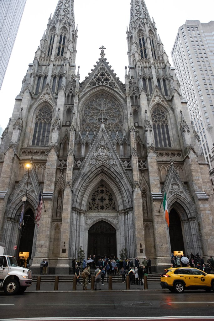 Parade participants are seen preparing for St. Patrick's Day on the steps of St. Patrick's Cathedral in New York, Monday, March 17, 2025.