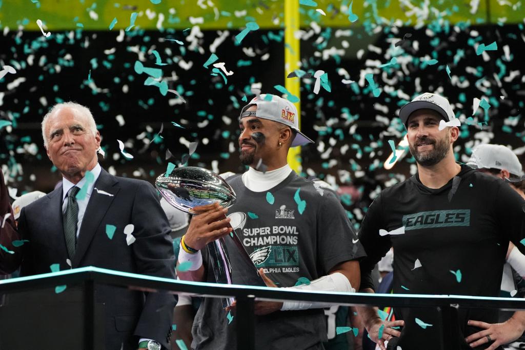 Eagles owner Jeffrey Lurie, quarterback Jalen Hurts and head coach Nick Sirianni celebrate after their Super Bowl win.