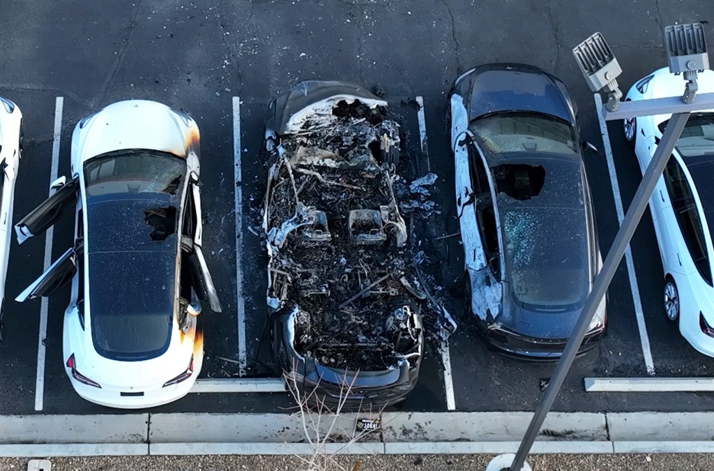 Police are investigating after several vehicles were set on fire at a Tesla service center, Tuesday, March 18, 2025, in Las Vegas.