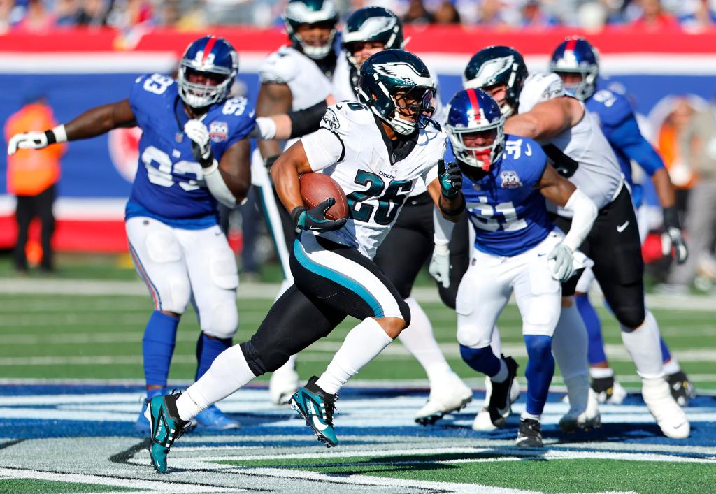 Philadelphia Eagles running back Saquon Barkley (26) rushes for a first down against the New York Giants during the second half, Sunday, Oct. 20, 2024 in East Rutherford, N.J. The Philadelphia Eagles won 28-3