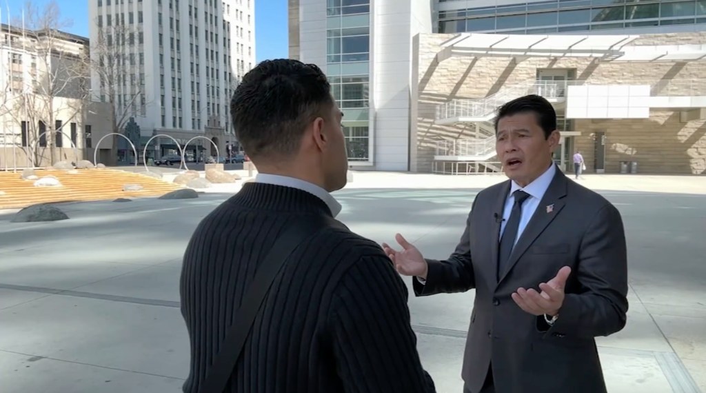 Councilmember Bien Doan talking to someone