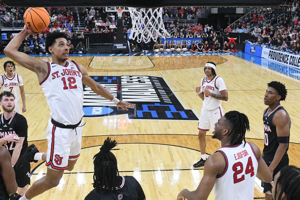 St. John's Red Storm guard RJ Luis Jr. driving to the basketball basket against the Omaha Mavericks during an NCAA tournament game.