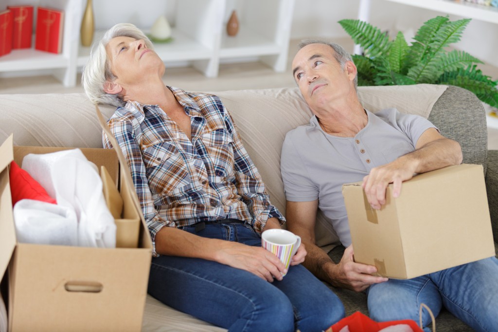 tired mature couple moving houses