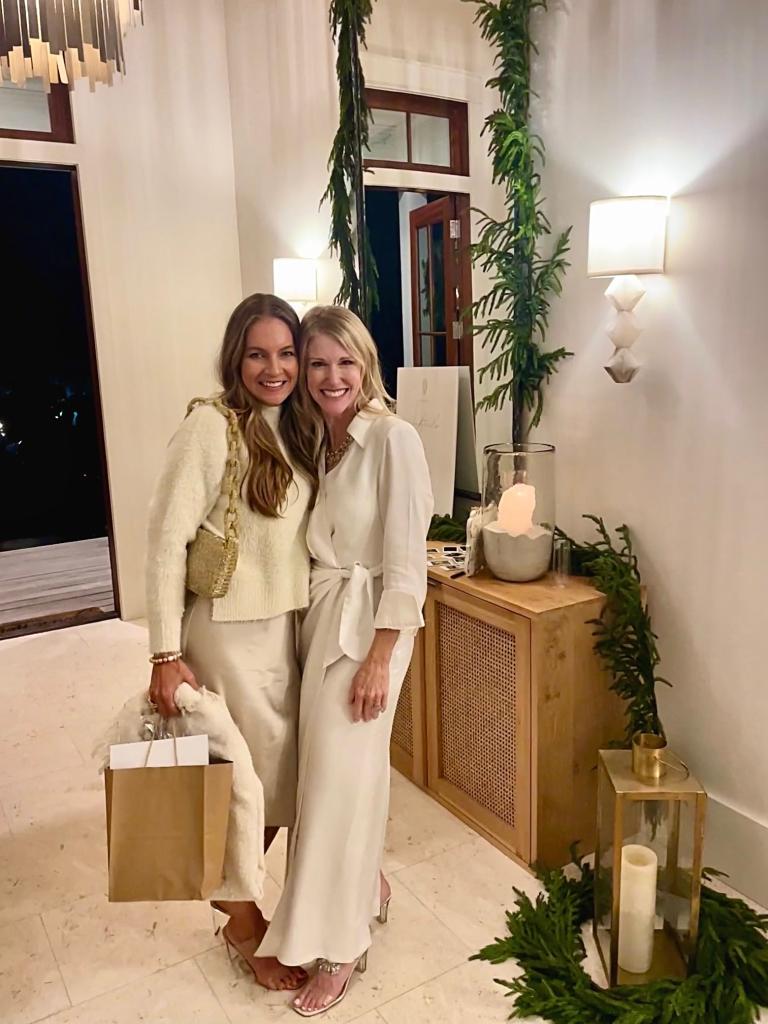 Michele Poole and Katherine Hill in white outfits smiling 