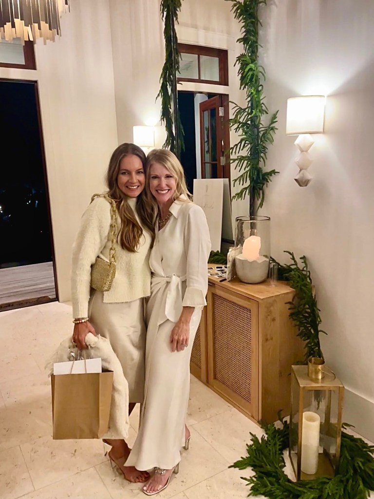 Michele Poole and Katherine Hill in white outfits smiling 