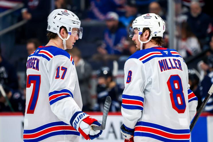 Will Borgen and JT Miller of the New York Rangers discuss strategy during a stoppage of play.