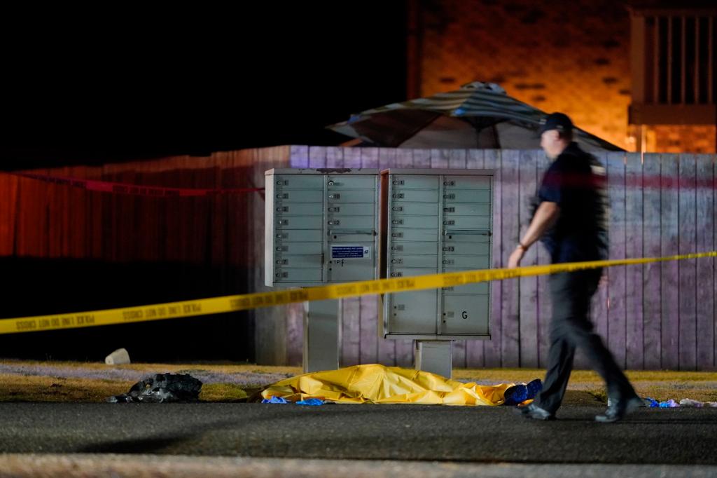 Officials work at the area late Thursday, Sept. 3, 2020, in Lacey Wash., where a man suspected of fatally shooting a supporter of a right-wing group in Portland, Ore., the week before was killed 