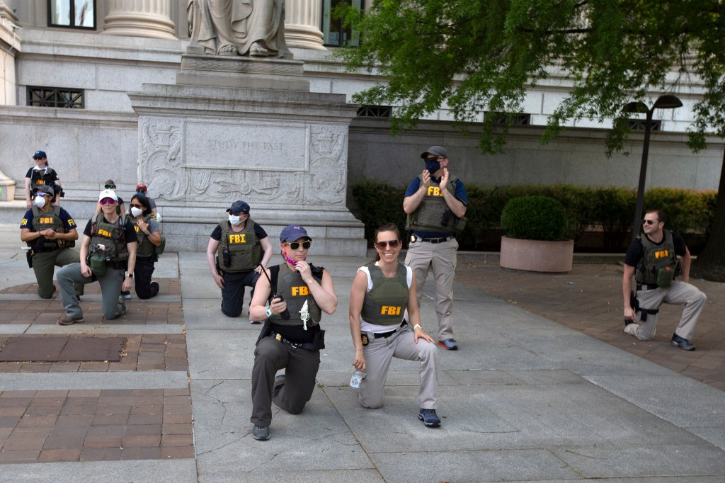 FBI agents take a knee