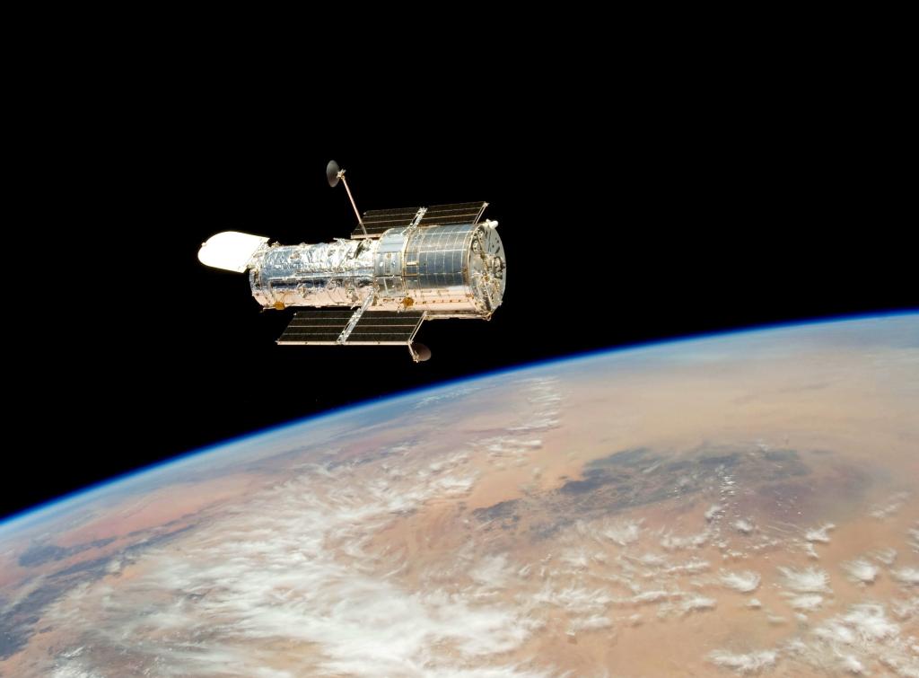The Hubble Space Telescope as it flies through low Earth orbit.