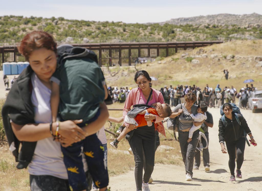 Hundreds of irregular migrants cross the border to Jacumba Hot Springs days after US President Joe Biden announced a decree to change migration policy at the border in California, United States on June 10, 2024.