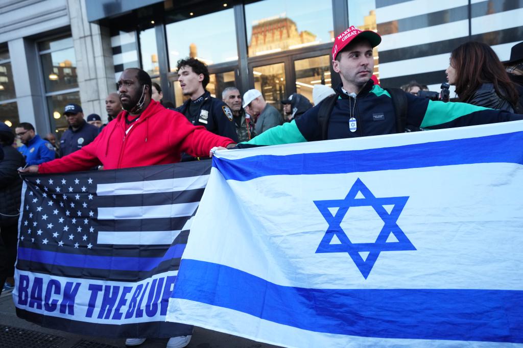 Counter-protesters confront pro-Palestine protesters s as they march following a demonstration at Federal Plaza calling for the release of Mahmoud Khalil on Monday, March 10, 2025 in New York