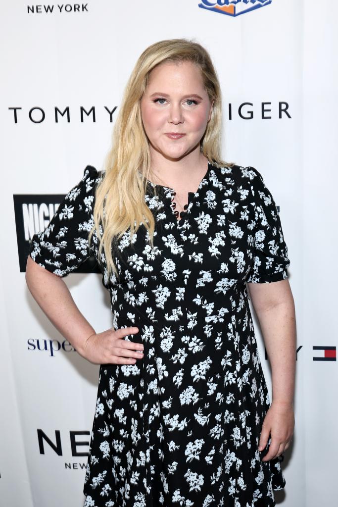 Amy Schumer attending the 2025 Night of Too Many Stars benefit for NEXT for AUTISM, dressed in a black and white dress in New York City