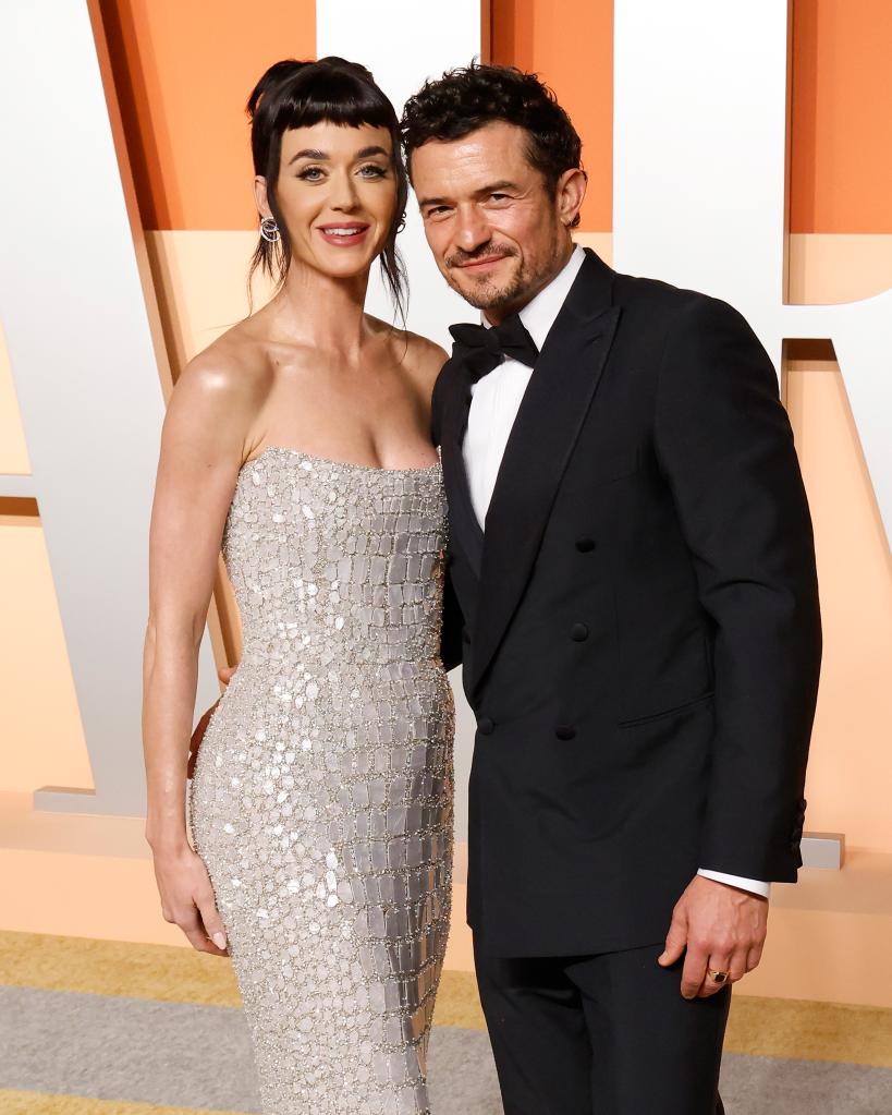 Katy Perry and Orlando Bloom attend the 2025 Vanity Fair Oscar Party hosted by Radhika Jones at Wallis Annenberg Center for the Performing Arts on March 02, 2025 in Beverly Hills, California. 