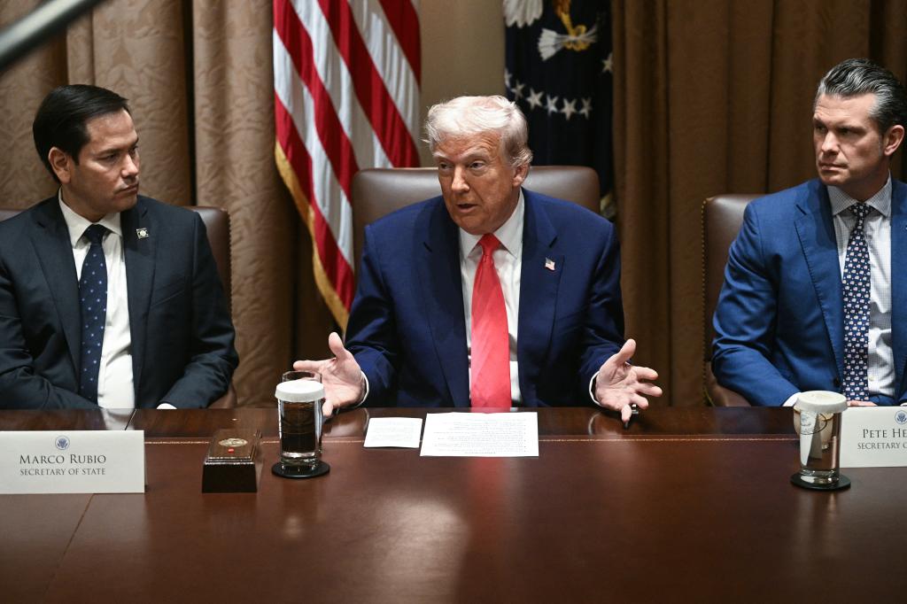 President Donald Trump, alongside Secretary of State Marco Rubio (L) and Secretary of Defense Pete Hegseth (R), speaks during a cabinet meeting in the Cabinet Room of the White House on April 10, 2025