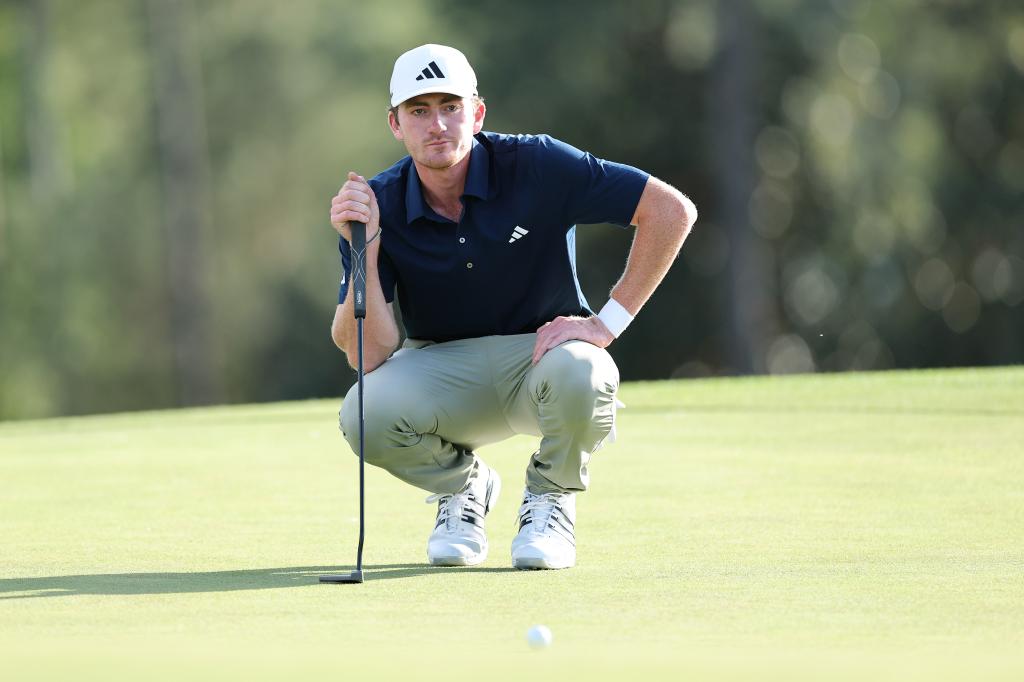 Nick Dunlap of the United States prepares to play a shot on the 18th hole during the second round of the 2025 Masters Tournament at Augusta National Golf Club on April 11, 2025 in Augusta, Georgia.