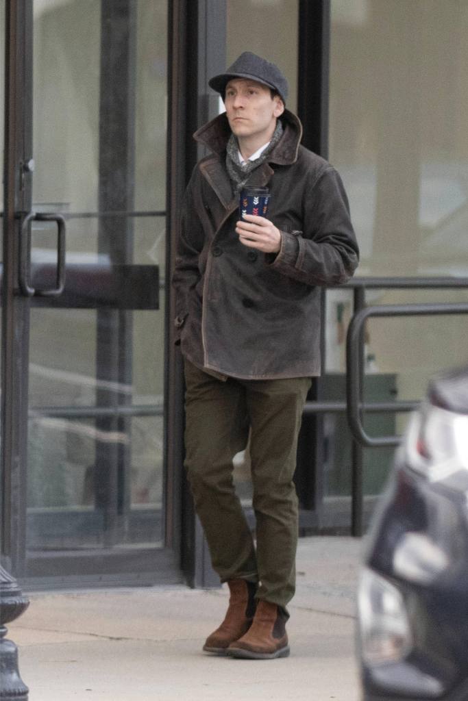 Erik Per Sullivan, known for his role as Dewey on the sitcom Malcolm in the Middle, is pictured leaving his house and picking up a coffee in Boston.