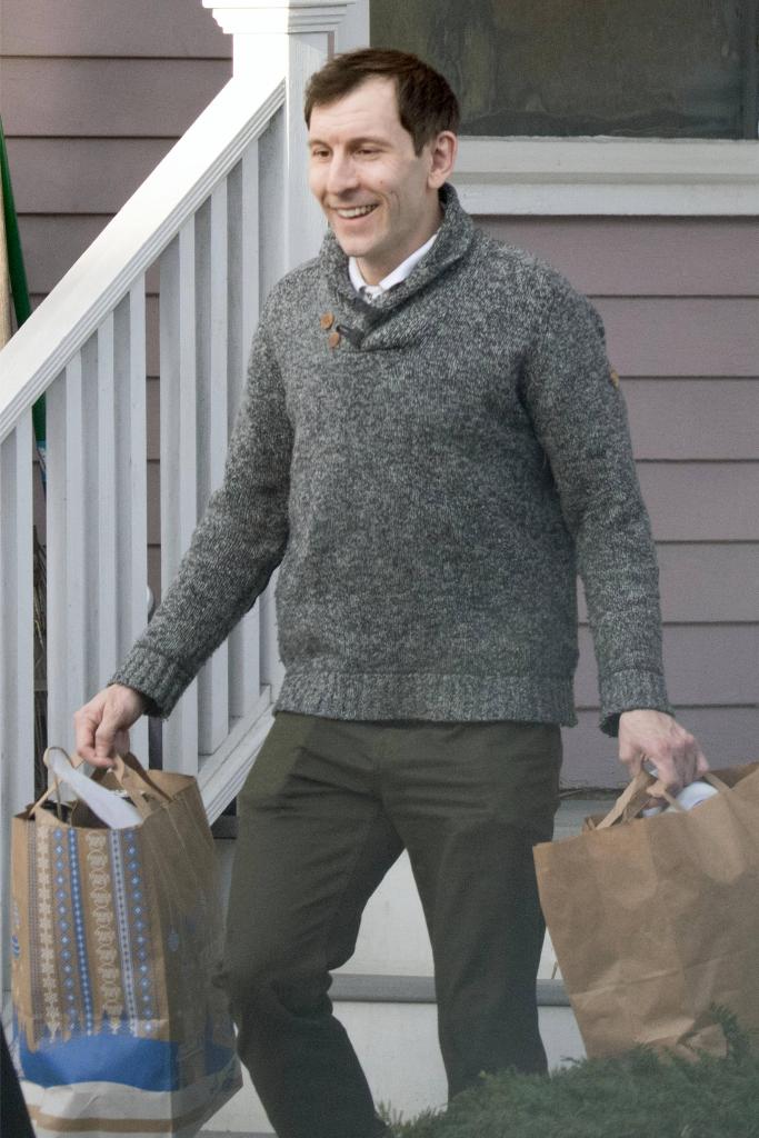 Erik Per Sullivan, known for his role as Dewey on the sitcom Malcolm in the Middle, is pictured leaving his house and picking up a coffee in Boston.