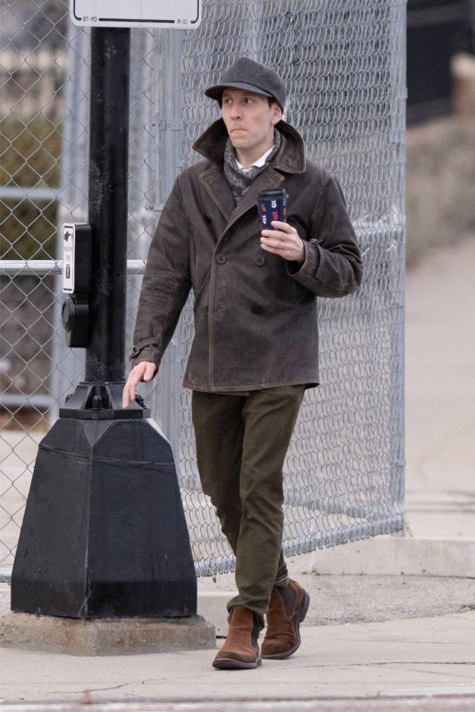 Erik Per Sullivan, known for his role as Dewey on the sitcom Malcolm in the Middle, is pictured leaving his house and picking up a coffee in Boston.