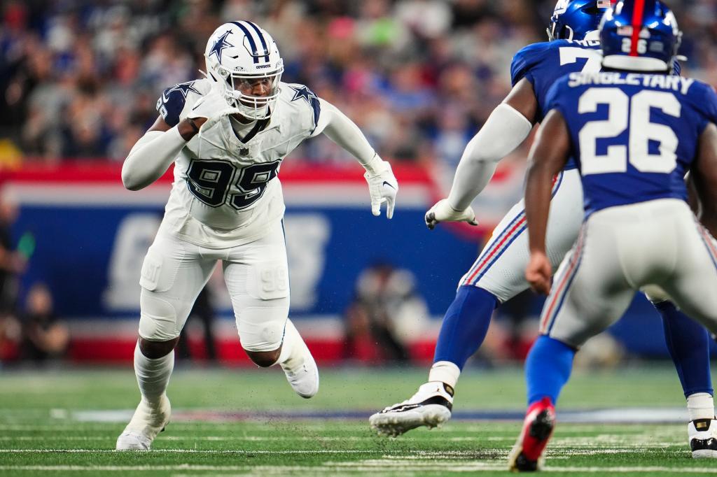 Chauncey Golston #99 of the Dallas Cowboys rushes the passer during an NFL football game against the New York Giants at MetLife Stadium on September 26, 2024 in East Rutherford, New Jersey. 
